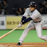 Igniting the offense: Lions outfielder Takayuki Shimizu puts the Lions on the scoreboard first with an RBI double in the sixth inning off Fighters hurler Yu Darvish on Friday. The game wasn\'t finished at press time. | KYODO PHOTO