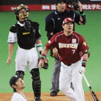 Not enough: Rakuten\'s Takeshi Yamasaki hits a bases-loaded double in the seventh inning off Fighters pitcher Shintaro Ejiri at Sapporo Dome on Wednesday. Nippon Ham came back to beat the Golden Eagles 9-8. | KYODO PHOTO