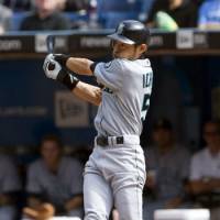 Milestone hit: Seattle Mariners outfielder Ichiro Suzuki raps his 200th hit of the season, a fifth-inning single up the middle against the Toronto Blue Jays on Thursday. He is the first player in Major League Baseball history with 10 straight 200-hit seasons, extending his own record. | AP PHOTO