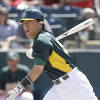 Making a difference: Hideki Matsui and the Oakland Athletics are doing their share to help in the relief efforts after the Tohoku earthquake and tsunami. | AP PHOTO
