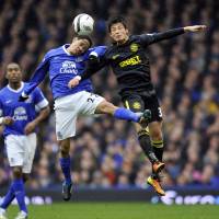 Out of action: Wigan Athletic’s Ryo Miyaichi (right) is done for the season after suffering an ankle injury last weekend in the F.A. Cup quarterfinals. Wigan's Miyaichi awaits season-ending ankle surgery