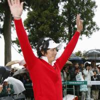 Ryo Ishikawa waves to the crowd at the Taiheiyo Club in Shizuoka Prefecture Sunday after becoming the youngest player to register 10 victories on the JGTO tour. | KYODO