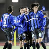 Christmas cracker: Gamba Osaka\'s Lucas takes the plaudits after opening the scoring in his side\'s 2-1 Emperor\'s Cup quarterfinal win over Nagoya Grampus on Thursday. | KYODO PHOTO