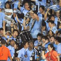 Celebration: Kawasaki Frontale forward Juninho (10) celebrates his goal with fans during the second half of Wednesday\'s Nabisco Cup quarterfinal match against Kashima Antlers. Frontale won 3-0 to advance to the semis. | KYODO PHOTO