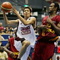 Japan\'s Royota Sakurai drives past Angola\'s Joaquim Gomez in Group B action in Hiroshima on Sunday. Angola won 87-62. | AP PHOTO
