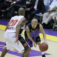 Crouching tiger: Tokyo Apache point guard Cohey Aoki dribbles as Osaka Evessa point guard Nile Murry defends him at Yoyogi National Gymnasium on Thursday. | TOKYO APACHE