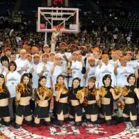 Team spirit: The Ryukyu Golden Kings celebrate after beating the Hamamatsu Higashimikawa Phoenix 89-73 to win the bj-league title on Sunday. | YOSHIAKI MIURA
