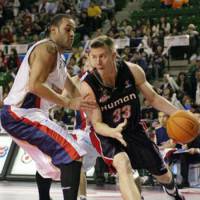 Victim of circumstances: Oita HeatDevils guard Matt Lottich (right), seen playing for the Osaka Evessa in 2008, is one of four players whose contracts have been voided by the cash-strapped franchise. | YOSHIAKI MIURA