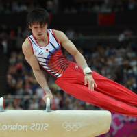 Second after appeal: Kohei Uchimura competes on the pommel horse in the men\'s all-around final at North Greenwich Arena on Monday. Japan took the silver medal in the event. | AP
