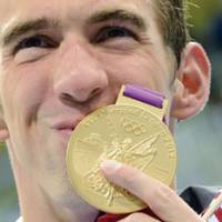 One for the ages: Michael Phelps became the most decorated Olympian ever after winning his 19th medal, a gold, in the men\'s 4x200 freestyle relay on Tuesday in London. Phelps tied the record, held by Soviet gymnast Larisa Latynina, by finishing between bronze medalist  Takeshi Matsuda (left) and winner Chad le Clos in the men\'s 200-meter butterfly earlier in the night. | AFP-JIJI