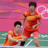 Shamed: China\'s Wang Xiaoli (right) and Yu Yang were kicked out of the London Games by Badminton World Federation officials on Wednesday for trying to lose a match. | AFP-JIJI