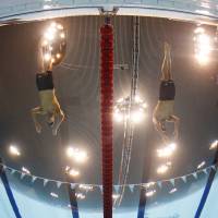 Clash of the titans: Michael Phelps (center left) and Ryan Lochte (center right) start the men\'s 200-meter individual medley final at the London Olympics on Thursday. Phelps won to claim his first individual gold medal of the 2012 Games. | AP