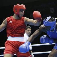 History in the making: Jordan\'s Ihab Almatbouli (right) is the first boxer from his nation to record a win at the Olympics. | AP