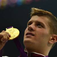 Never forget you: Daniel Gyurta, who won the 200-meter breaststroke final, plans to present a copy of his gold medal to the family of the late Alexander Dale Oen. | AFP-JIJI