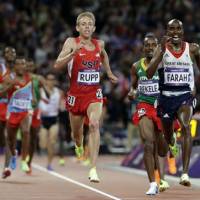 Go Mo!: Britain\'s Mo Farah (right) comes home to win the men\'s 10,000-meter final at the London Olympics on Saturday. | AP