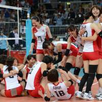 Exhausting battle: Japan\'s women\'s volleyball team celebrates after beating China in the Olympic quarterfinals on  Tuesday at Earls Court in London. Japan will compete in the semifinals for the first time since 1988. | AFP-JIJI