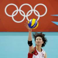 Brilliant victory: Saori Kimura serves against China in their quarterfinal match on Tuesday at Earls Court. Japan won 3-2 and will play Brazil in the semifinals on Thursday night. | AP