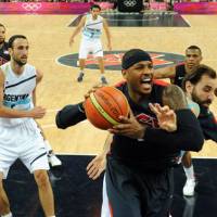 Getting too old for this: A potential age limit would keep some NBA stars, including Carmelo Anthony of the U.S. (with ball), out of Olympic competition. | AP