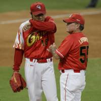 Teaching the fundamentals: China manager Jim Lefebvre removes pitcher Wang Nan in the bottom of the second inning against Cuba on Wednesday. Lefebvre has helped lay the foundation for what he hopes is a bright future for baseball in China. | AP PHOTO