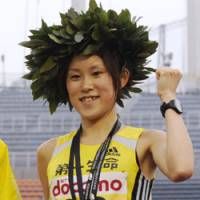 Crowning achievement: Yoshimi Ozaki celebrates winning the Tokyo International Women\'s Marathon on Sunday, in a time of 2 hours 23 minutes, 30 seconds. | KYODO PHOTO
