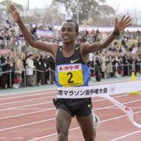 Fast finish: Ethiopia\'s Tesgaye Kebede crosses the finish line in 2 hours, 6 minutes, 10 seconds to win the 62nd annual Fukuoka International Marathon on Sunday. | KYODO PHOTO