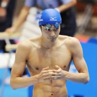 Make it double: Ryosuke Irie wins the men\'s 200-meter backstroke on Saturday at Tokyo Tatsumi International Swimming Center. This is his second victory at the ongoing Japan Open following Friday\'s 100 backstroke. | KYODO PHOTO