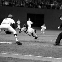 No holding back: Cincinnati Reds star Pete Rose dives headfirst into third base in the ninth inning of Game 7 of the 1975 World Series against the Boston Red Sox. | AP PHOTO