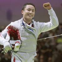 Leading the way: Yuki Ota helps Japan earn a bronze medal in the team foil event at the World Fencing Championships in Paris. | KYODO PHOTO
