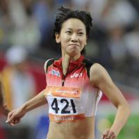 First past the post: Chisato Fukushima smiles after crossing the finish line. | KYODO PHOTO