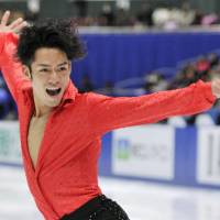 Defending champion Daisuke Takahashi performs his short program at the national championships on Friday in Nagano. Takahashi got off to a got off to a shaky start and trails in fourth place. | KYODO PHOTOS