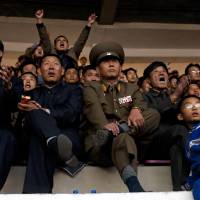 One for all: North Korean fans watch their country’s World Cup qualifier against Uzbekistan at Pyongyang’s Yanggakdo Stadium last month. Home comforts in short supply as Japan aims for final round