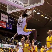 Hang time: Five Arrows center Nyika Williams completes a reverse slam dunk against the 89ers on Saturday in Sendai. Takamatsu lost 86-78. | DOMINIKA FITZGERALD