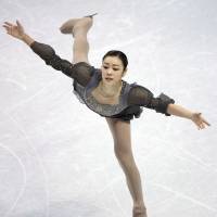 Poetry in motion: Kim Yu Na\'s performance at last week\'s worlds illustrated just how far she is ahead of her rivals with less than a year to go before the Sochi Games. | AP