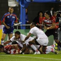 Down and dirty: Japan openside flanker Michael Leitch scores a try for the Brave Blossoms against Tonga during the first half of  their clash at the Rugby World Cup on Wednesday. Tonga won 31-18. | AKI NAGAO