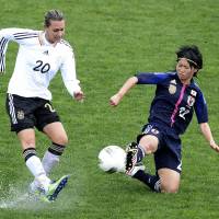 Beaten again: Yoko Tanaka tackles Germany\'s Lena Groessling during their Algarve Cup match on Friday in Parchal, Portugal. Germany defeated Nadeshiko Japan 2-1. | AFP-JIJI