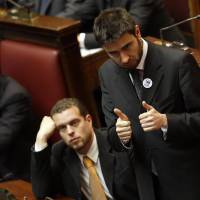 Double trouble: Five Star Movement party lawmaker Alessandro di Battista (right) attends a Parliament session to elect the lower chamber\'s president in Rome on March 16. | AP