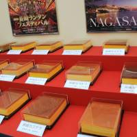 A selection of castella cakes from Nagasaki Prefecture, displayed like museum pieces under glass. | SATOKO KAWASAKI