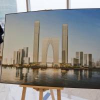 Of grave concern: An illustration of a real estate development is displayed in Suzhou, China, in 2011. The country is mulling sea burials as its breakneck growth has sent grave prices rocketing. | BLOOMBERG