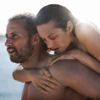 Triumphant in love: A complex relationship unfolds between bare-knuckle fighter Ali (Matthias Schoenaerts) and freshly disabled Stephanie (Marion Cotillard) in “Rust and Bone.” Audiard's method: as slow and steady as the waves