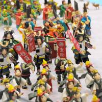 Don\'t forget your toothbrush: The 26th National Confectionary Exposition, running now in Hiroshima, boasts 6,000 snacks from around Japan and intricate sugary sculptures, such as these sweet warriors. | SATOKO KAWASAKI