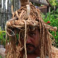 Grass hat: A dance performer at Highland Paradise sports a traditional warrior helmet adorned with wild boar tusks. | CHRISTOPHER JOHNSON