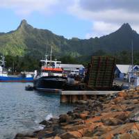 Heights from the deep: The picturesque harbor at Avarua on Rarotonga nestles under the peaks of a volcano that rises 4,500 meters from the ocean floor. | CHRISTOPHER JOHNSON