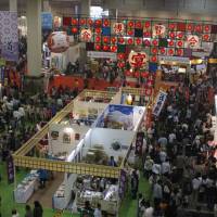 Tasty trip: Visitors gather at the International Food Expo Utage in 2009. The popular event happens every four years and features many different kinds of food. | &#169; 2013 \"SAKURANAMIKI NO MANKAI NO SHITA NI\" SEISAKU IINKAI