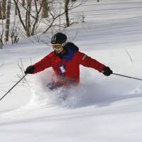 Instructor-guide Tomo Shuhama shows his fine style on an ungroomed and testing slope. | CHRISTOPHER JOHNSON PHOTO