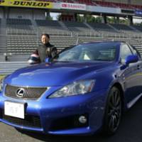 Akio Toyoda, executive vice president of Toyota Motor Corp., shows off the automaker\'s new Lexus IS F luxury sports car at its unveiling Thursday at Fuji Speedway. | AP PHOTO