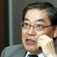 Behind schedule: Michijiro Kikawa, chief executive officer of Hitachi Construction Machinery Co., is interviewed in Tokyo on Monday. | BLOOMBERG