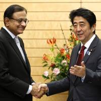 Foundation building: Indian Finance Minister Palaniappan Chidambaram is greeted by Prime Minister Shinzo Abe during his Monday courtesy call at Abe\'s office in Tokyo. | POOL
