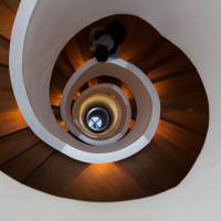 Downward spiral: An unidentified man descends a flight of stairs in the Canon Korea Consumer Imaging Inc. building in Seoul on March 23. South Korea\'s economy grew less than expected in the fourth quarter, underscoring concern that a weaker yen will curb exports. | BLOOMBERG
