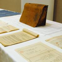 Time capsule: Draft plans and other documents from the 1920s linked to U.S. architect Jay Hill Morgan are displayed in Yokohama on Thursday, alongside the briefcase they were found in. | KYODO
