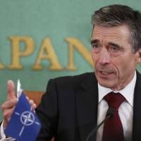 Extended reach: NATO Secretary General Anders Rasmussen holds a news conference Monday at the Japan National Press Club in Tokyo ahead of talks with top Japanese officials. | AP